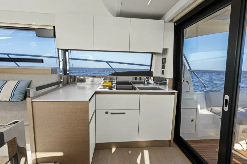 Slide: The Image of Modern kitchen interior on 2022 Prestige 460 yacht with ocean view. - 13
