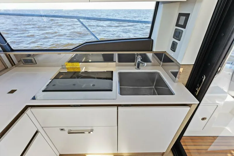 Slide: The Image of Modern kitchen on 2022 Prestige 460 yacht with ocean view. - 14