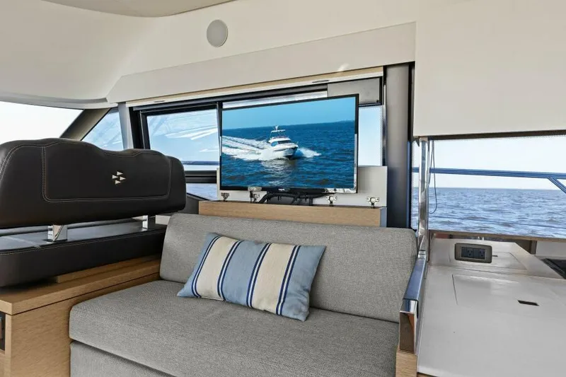 Slide: The Image of Luxurious interior of 2022 Prestige 460 yacht with ocean view and TV. - 15