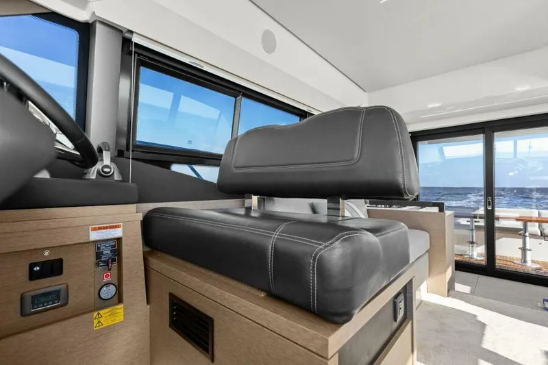 Slide: The Image of Interior of 2022 Prestige 460 yacht with modern seating and ocean view. - 22