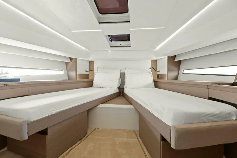 Slide: The Image of Luxurious twin cabin interior of 2022 Prestige 460 yacht, featuring modern design and comfortable bedding. - 34