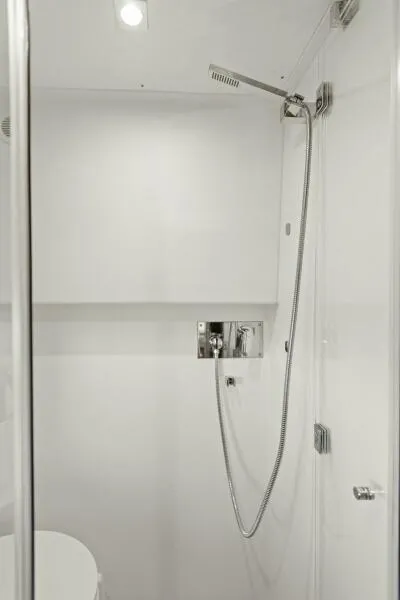 Slide: The Image of Modern shower in 2022 Prestige 460 yacht bathroom, featuring sleek design and chrome fixtures. - 39