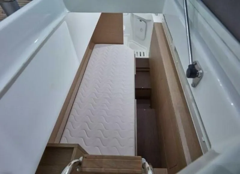 Slide: The Image of Interior cabin of 2022 Prestige 460 yacht with a white mattress. - 42