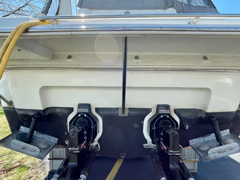 Slide: The Image of 2001 Cruisers Yachts 3075 Express boat stern with dual outboard motors. - 22