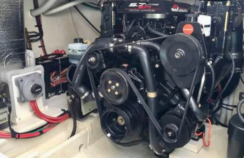 Slide: The Image of Engine compartment of 2001 Cruisers Yachts 3075 Express, featuring a 5.7L engine. - 24