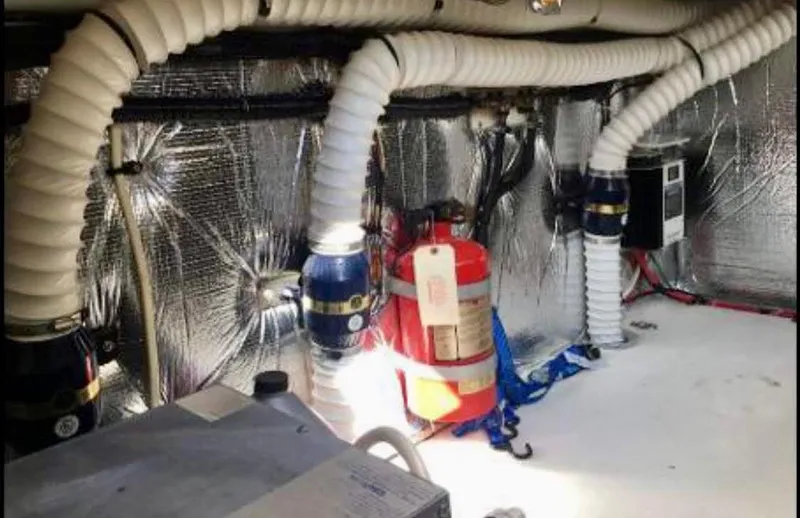 Slide: The Image of Engine room of 2001 Cruisers Yachts 3075 Express with fire extinguisher and ventilation hoses. - 27