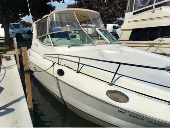 Slide: The Image of 2001 Cruisers Yachts 3075 Express docked at marina. - 6