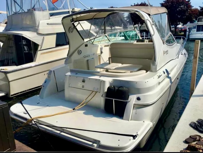 Slide: The Image of 2001 Cruisers Yachts 3075 Express docked at marina, rear view. - 7