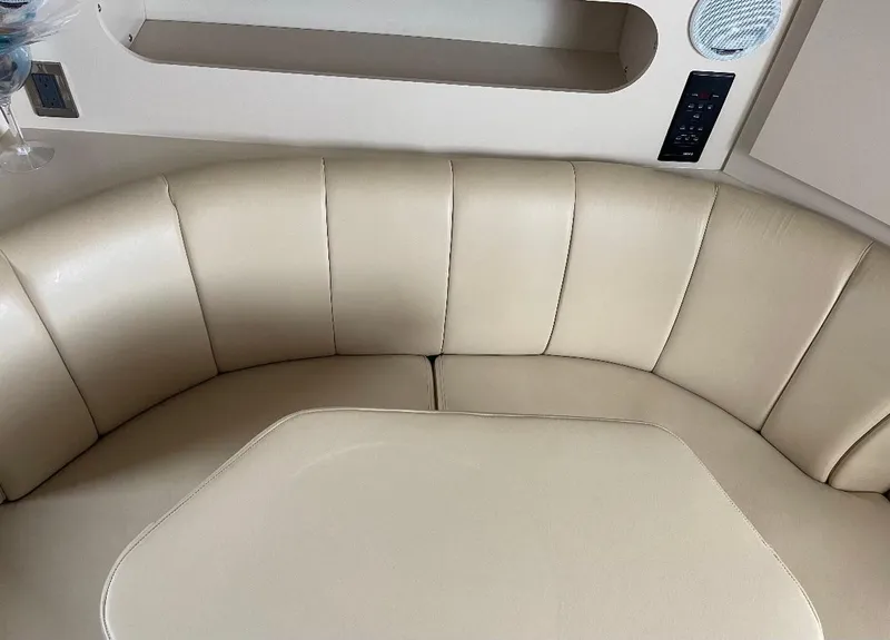 Slide: The Image of Beige leather seating in 2001 Cruisers Yachts 3075 Express interior. - 17