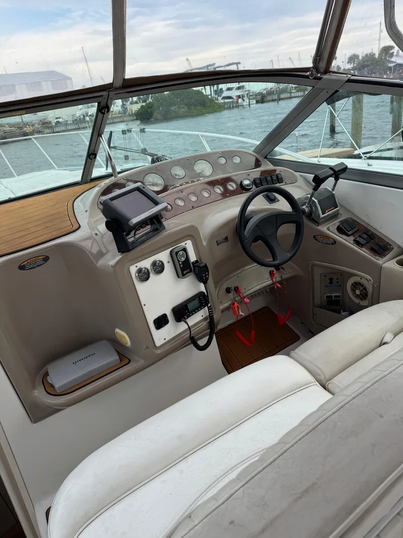 Slide: The Image of Maxum 3000 SCR 2000 boat cockpit with steering wheel and control panel. - 4