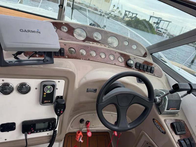 Slide: The Image of Maxum 3000 SCR 2000 boat dashboard with Garmin GPS and steering wheel. - 5