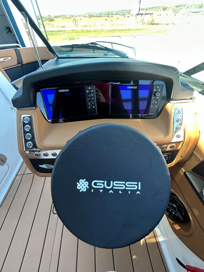 Slide: The Image of 2025 Chaparral 307 SSX boat dashboard with Gussi Italia steering wheel. - 8