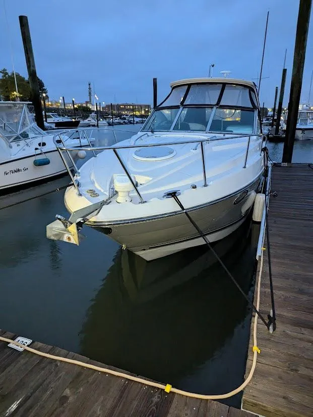 Slide: The Image of 2013 Monterey 280 Sport Yacht docked at marina during evening. - 1