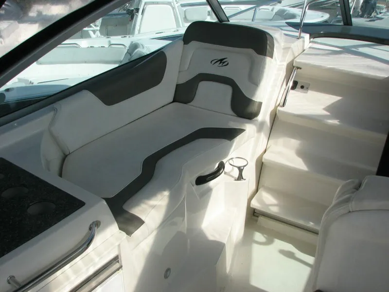 Slide: The Image of Interior seating of 2013 Monterey 280 Sport Yacht with cup holder. - 12