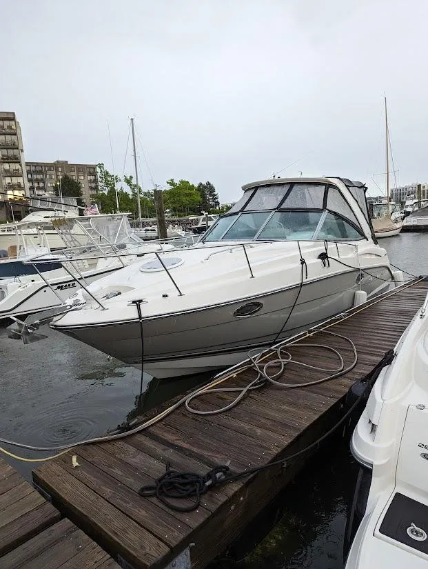 Slide: The Image of 2013 Monterey 280 Sport Yacht docked at marina, overcast day. - 2