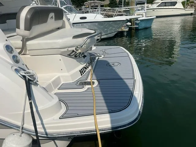 Slide: The Image of 2013 Monterey 280 Sport Yacht docked, featuring a spacious swim platform. - 3