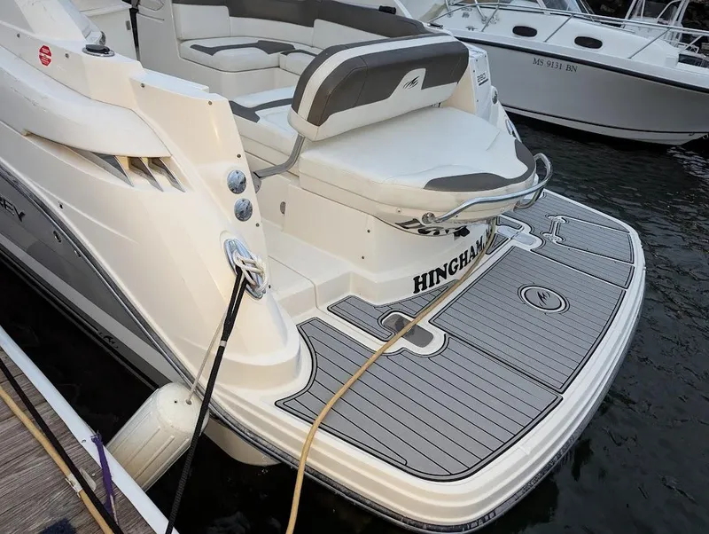 Slide: The Image of 2013 Monterey 280 Sport Yacht with spacious deck and seating at dock. - 4
