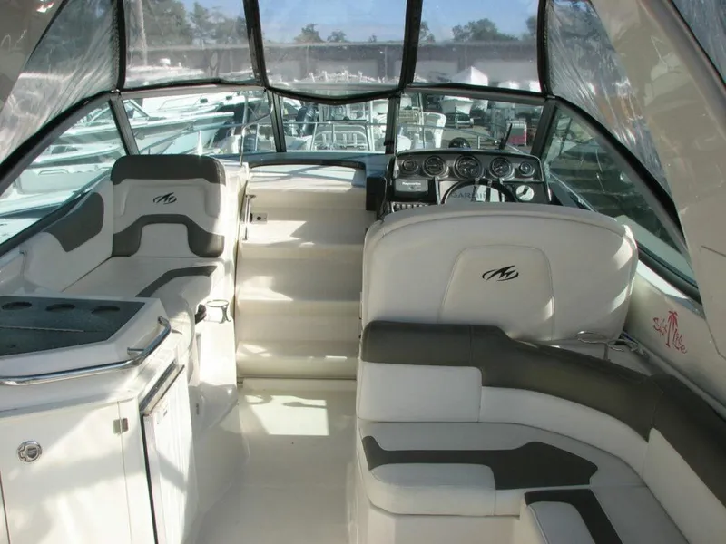 Slide: The Image of Interior of a 2013 Monterey 280 Sport Yacht with sleek seating and modern dashboard. - 9