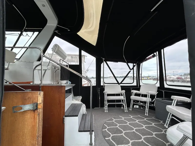 Slide: The Image of Interior of 1986 Marinette 39 Double Cabin with seating and nautical views. - 17