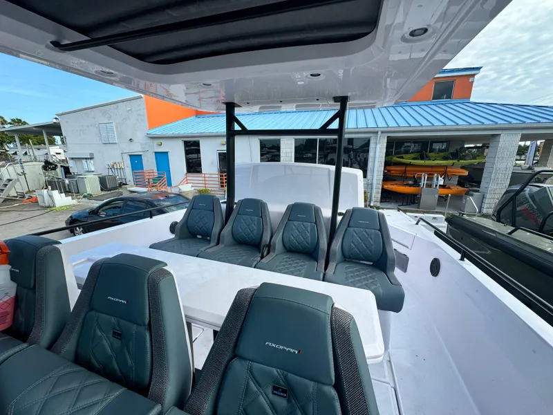 Slide: The Image of 2024 Axopar Sun Top boat interior with modern seating and sleek design. - 4