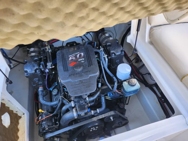 Slide: The Image of Engine compartment of a 2002 Sea Ray 240 Sundeck boat. - 24