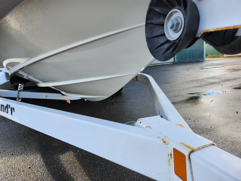 Slide: The Image of Close-up of a 2002 Sea Ray 240 Sundeck boat on a trailer. - 7