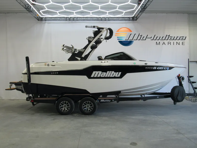 Slide: The Image of 2022 Malibu M220 boat on trailer at Mid-Indiana Marine showroom. - 0