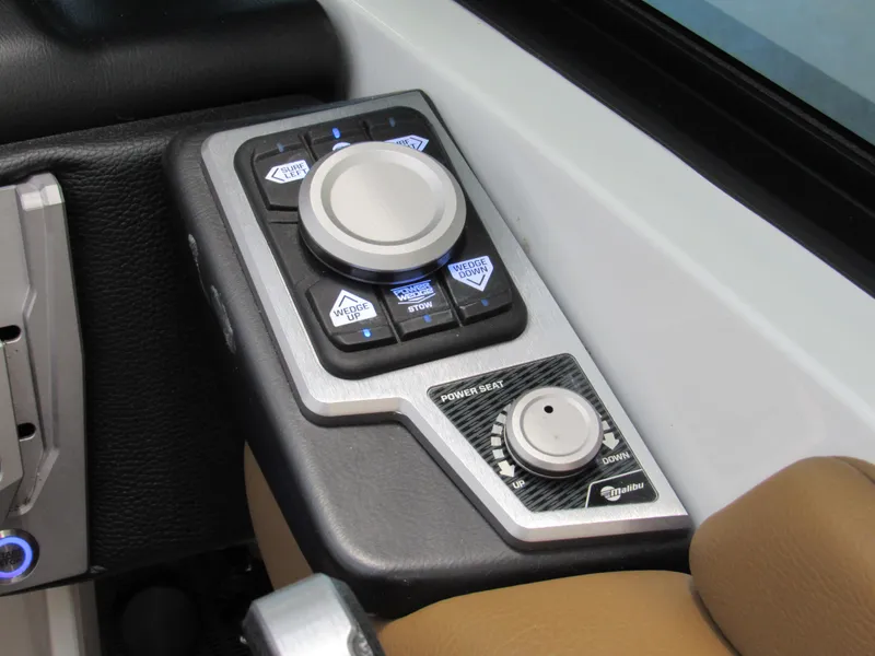 Slide: The Image of 2022 Malibu M220 boat control panel with joystick and buttons. - 16