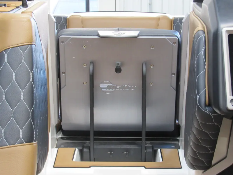 Slide: The Image of 2022 Malibu M220 boat interior with foldable seat and storage compartment. - 19