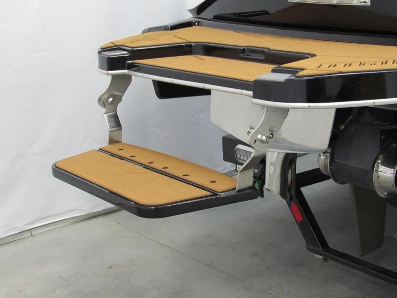 Slide: The Image of 2022 Malibu M220 swim platform with fold-down step, featuring sleek design and durable materials. - 5