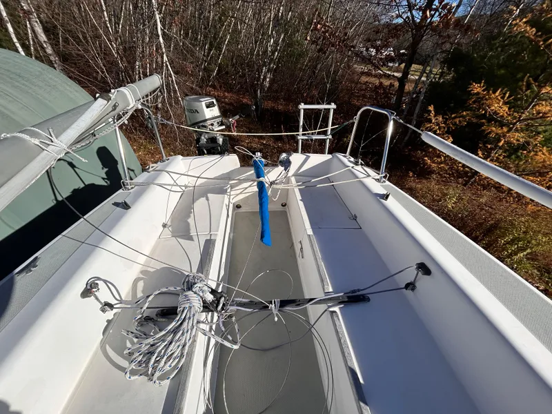 Slide: The Image of 1987 Catalina 22 Capri sailboat deck with rigging and outboard motor. - 11