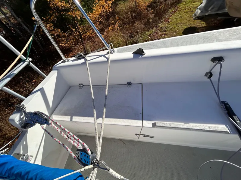 Slide: The Image of 1987 Catalina 22 Capri sailboat cockpit with ropes and seating area. - 13