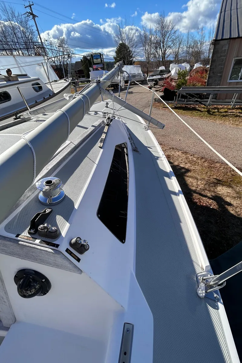 Slide: The Image of 1987 Catalina 22 Capri sailboat deck with clear sky background. - 21