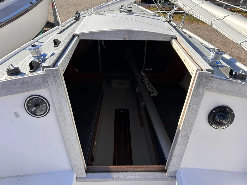 Slide: The Image of 1987 Catalina 22 Capri sailboat cabin entrance with open hatch and visible interior. - 27