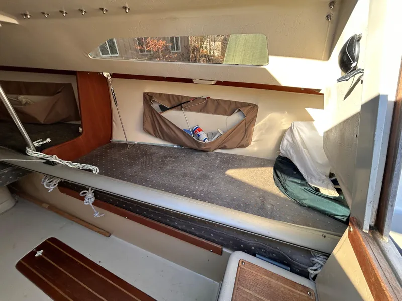 Slide: The Image of Interior of a 1987 Catalina 22 Capri sailboat, featuring a cozy cabin space. - 29