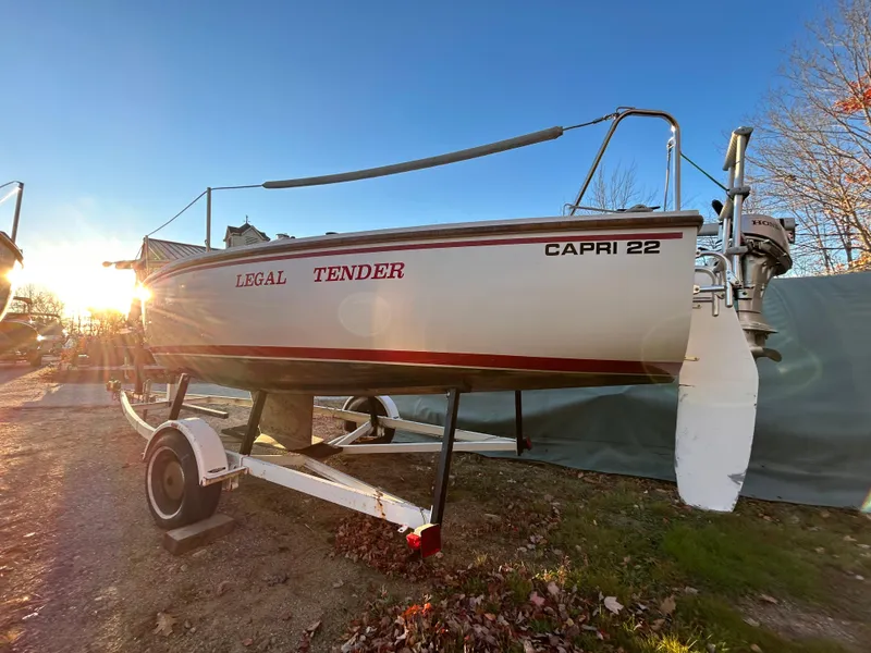 Slide: The Image of 1987 Catalina 22 Capri sailboat on trailer, sunset background. - 3