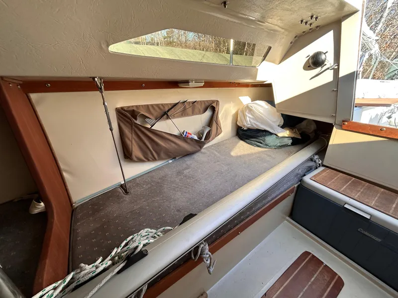 Slide: The Image of Interior of 1987 Catalina 22 Capri sailboat cabin with storage and seating. - 31