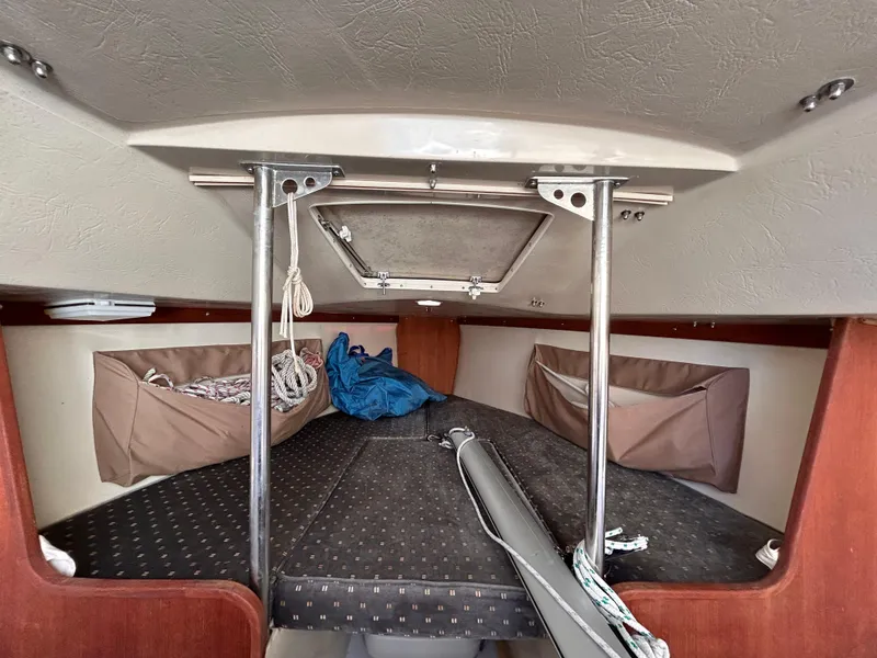 Slide: The Image of Interior of 1987 Catalina 22 Capri sailboat cabin with storage and cushions. - 35