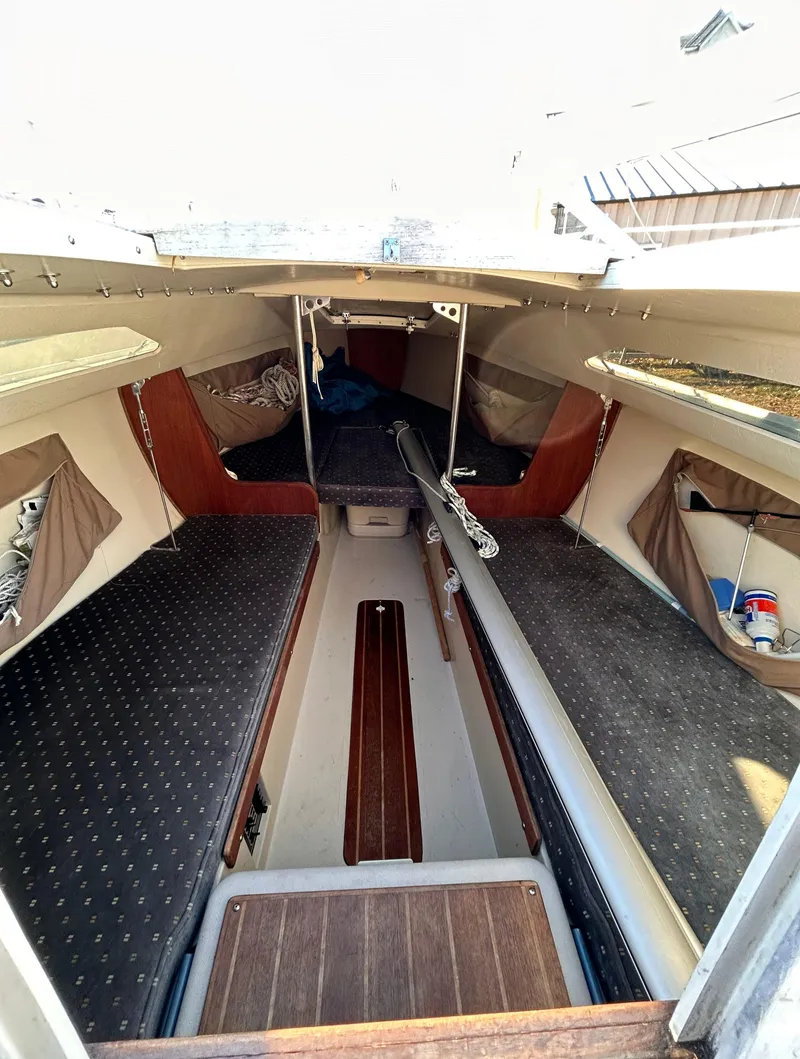 Slide: The Image of Interior of 1987 Catalina 22 Capri sailboat, featuring cozy cabin layout and storage. - 38