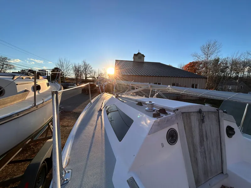 Slide: The Image of 1987 Catalina 22 Capri sailboat in a marina at sunset. - 4