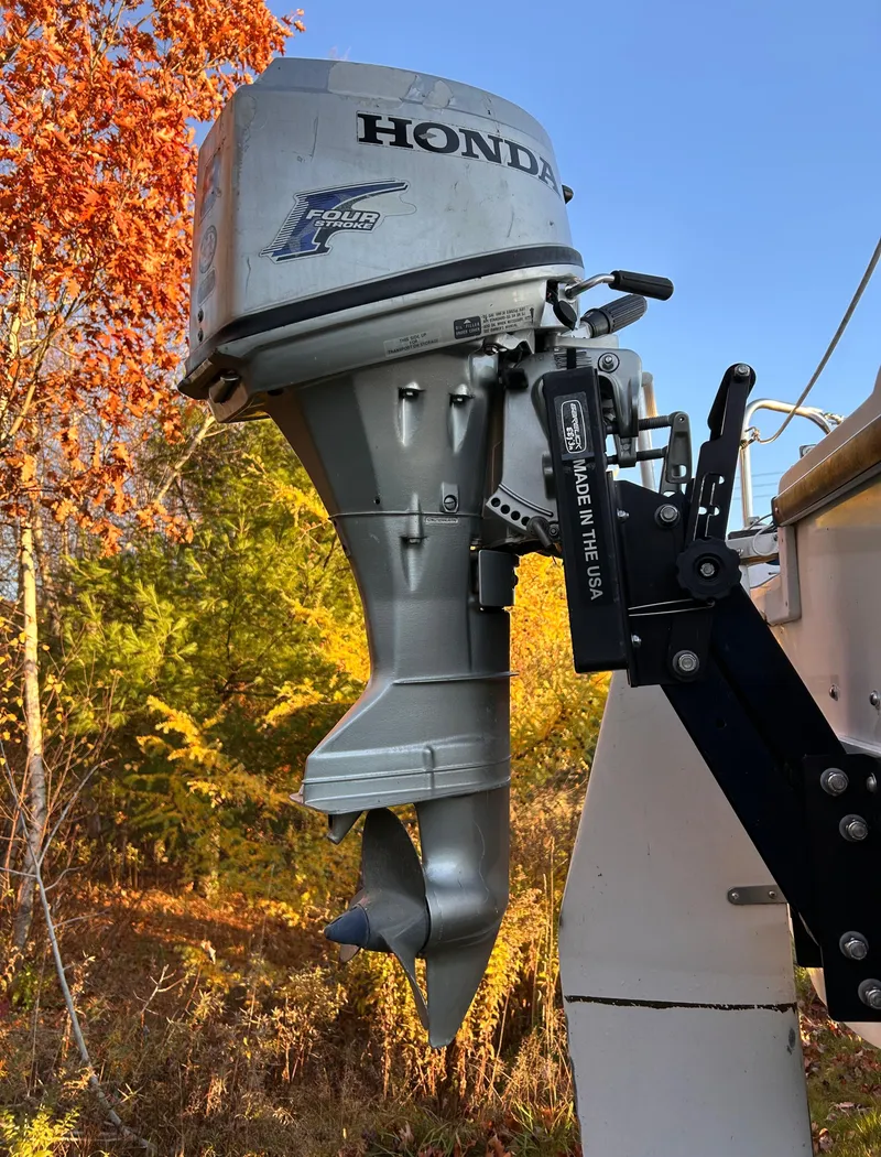 Slide: The Image of Honda outboard motor on 1987 Catalina 22 Capri sailboat, autumn foliage background. - 7