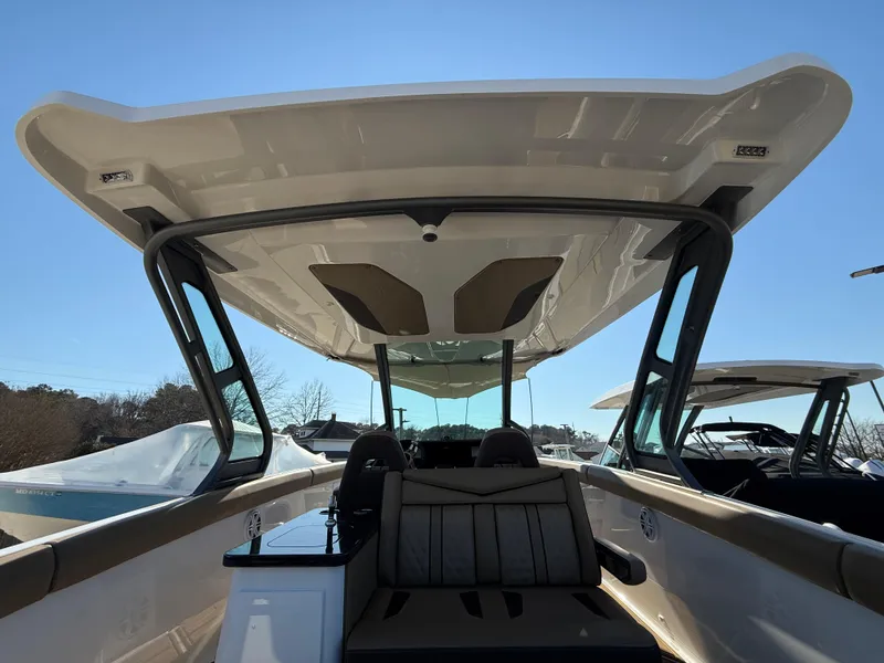 Slide: The Image of 2025 Monterey Elite 30 OB boat interior with sleek design and spacious seating. - 13