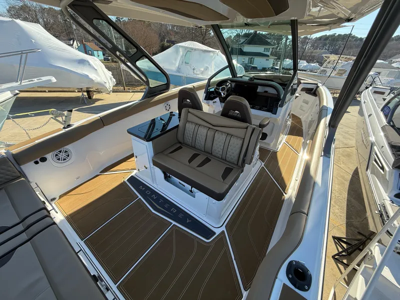 Slide: The Image of 2025 Monterey Elite 30 OB boat interior with luxurious seating and modern design. - 8