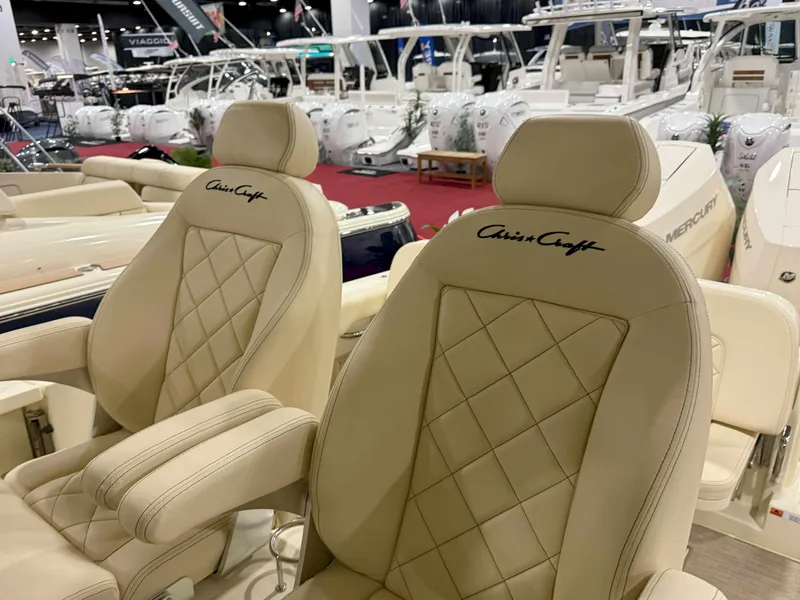 Slide: The Image of Luxurious Chris-Craft Catalina 30 seats, 2025 model, showcased at a boat exhibition. - 12