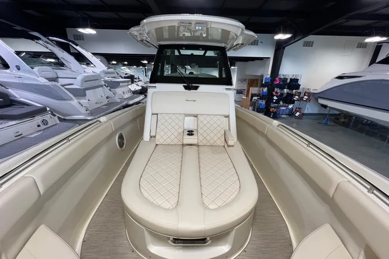 Slide: The Image of 2025 Chris-Craft Catalina 30 boat interior with luxurious seating in showroom. - 19