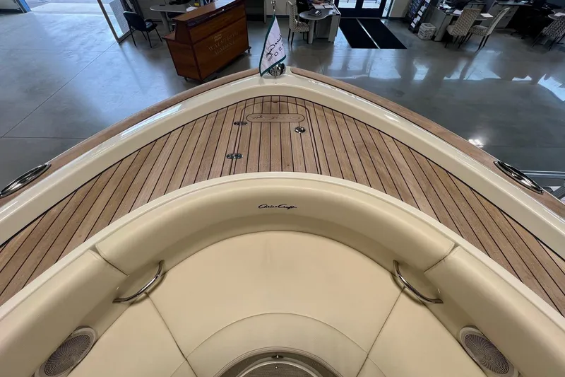 Slide: The Image of 2025 Chris-Craft Catalina 30 boat interior with elegant wood deck and cushioned seating. - 20