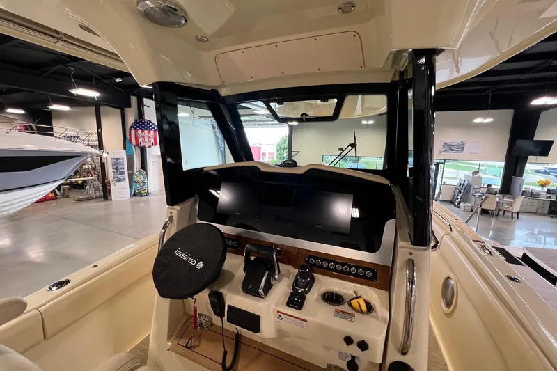 Slide: The Image of Interior view of 2025 Chris-Craft Catalina 30 boat dashboard in showroom. - 23