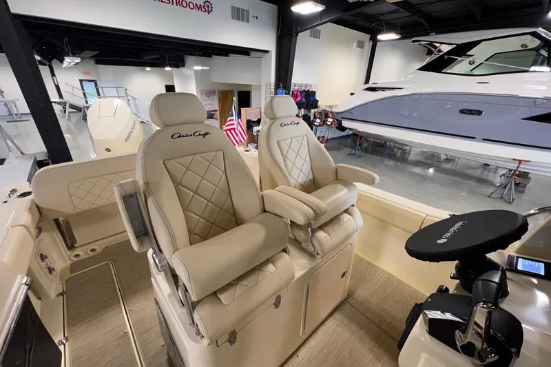 Slide: The Image of 2025 Chris-Craft Catalina 30 boat interior with luxurious seating in showroom. - 24