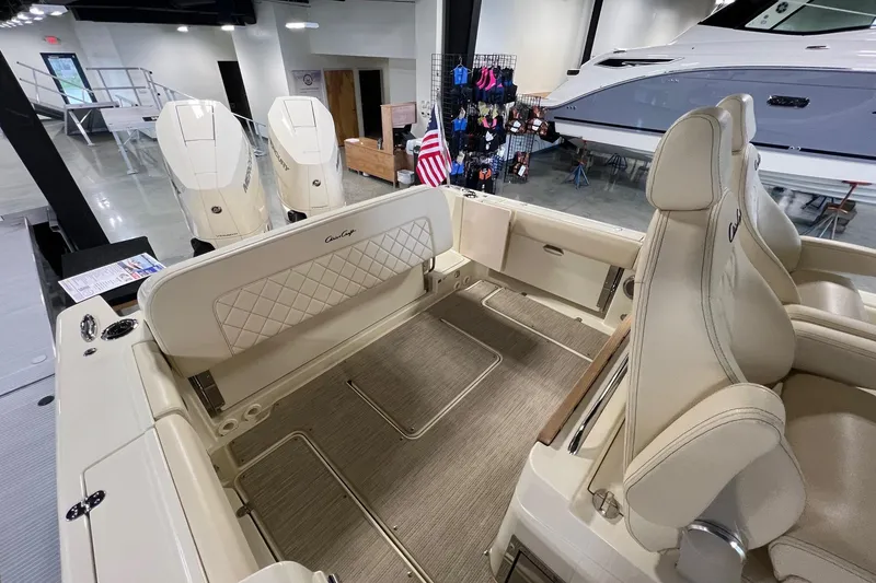 Slide: The Image of 2025 Chris-Craft Catalina 30 interior with luxurious seating and dual Mercury engines. - 25