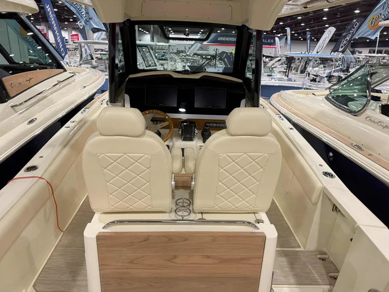 Slide: The Image of 2025 Chris-Craft Catalina 30 boat displayed indoors, showcasing sleek design and modern features. - 3